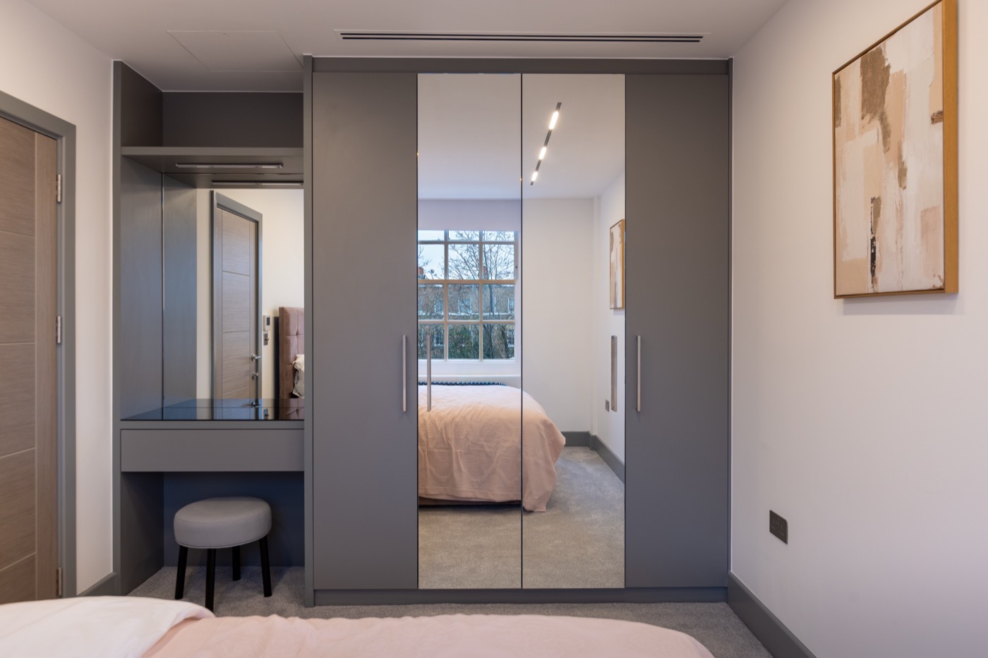 Bespoke wardrobe with organised shelving and lighting