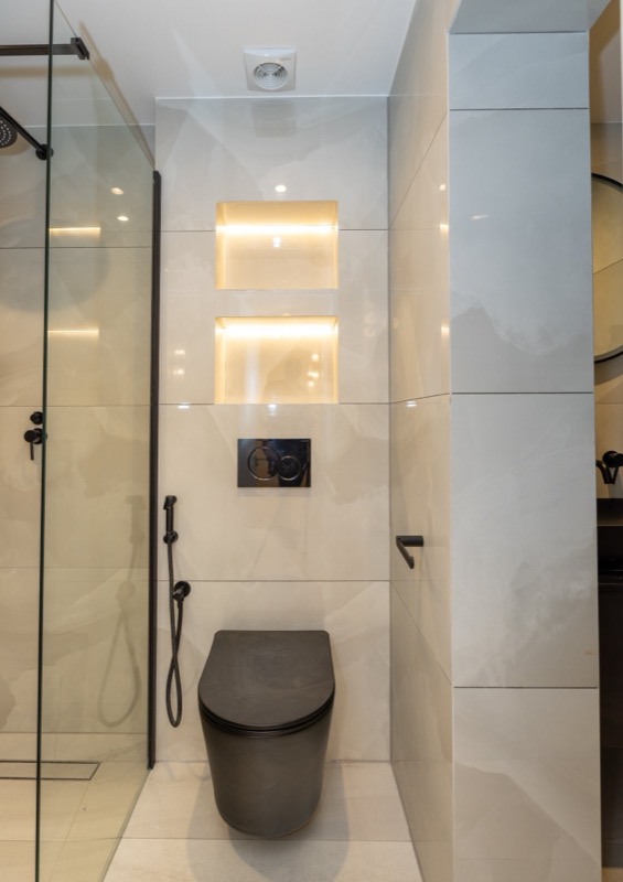 Contemporary bathroom with illuminated niches