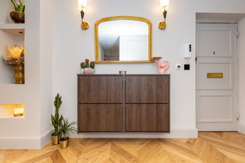 Elegant entrance hallway with illuminated display cabinet