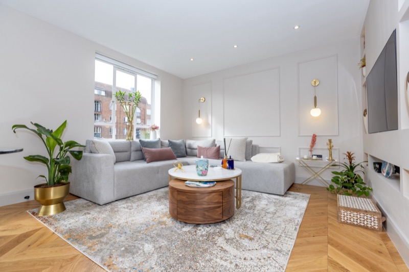 Bright living space with floor to ceiling windows