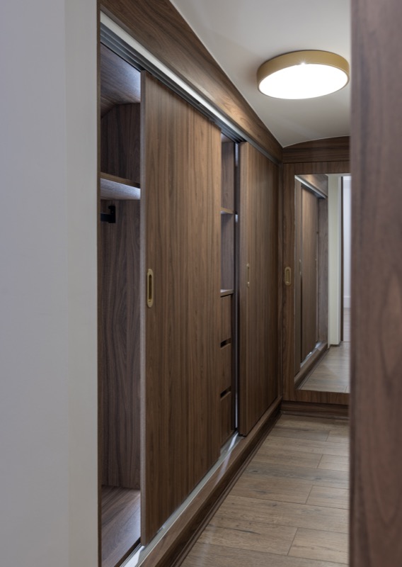 Bespoke walnut wardrobes with sliding doors